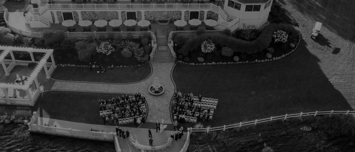 Aerial view of a waterfront ceremony at an Aviva property