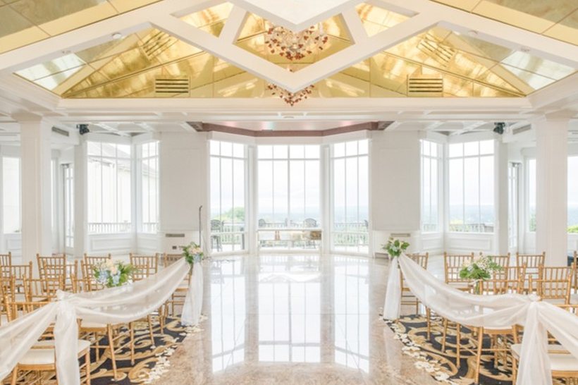 A ceremony set beneath the gilded ceiling at The One & Only Westmount Country Club, Woodland Park, New Jersey